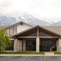 Medical clinic building set against the Tahoe mountains.