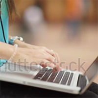 Woman typing on her laptop.